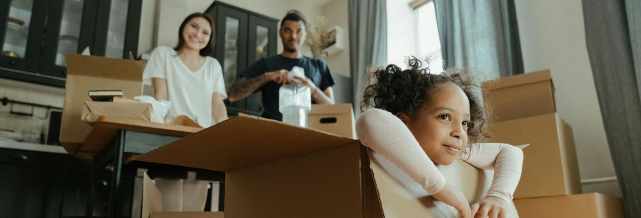 a family packing boxes