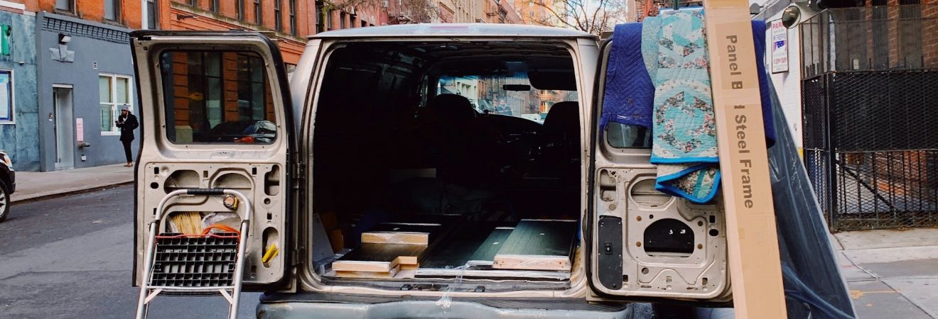 an open moving truck while items are being loaded on it