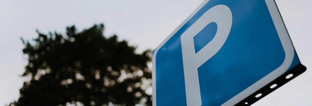 a blue parking sign