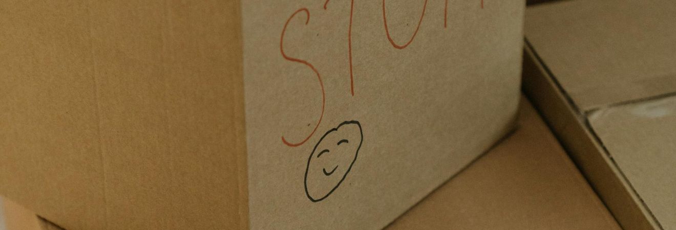 a cardboard box with a smiley face on it