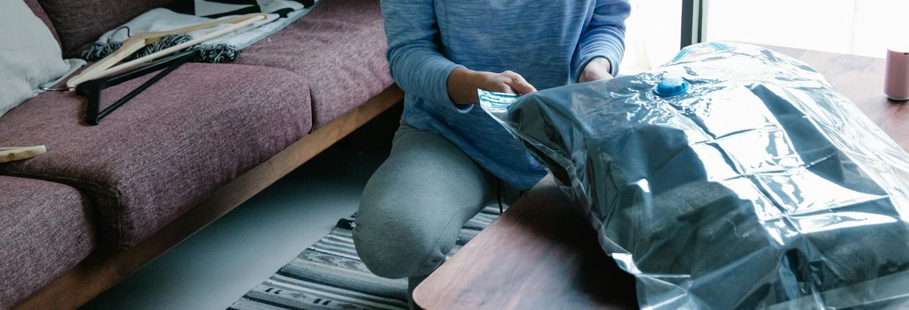 a woman packing her clothes