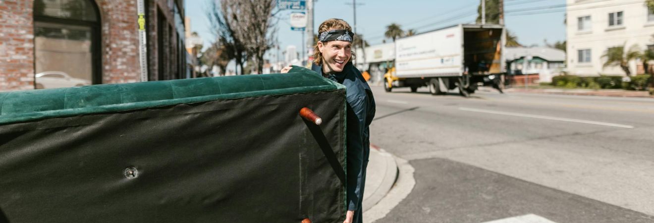 a man from movers Plantation holding a bed