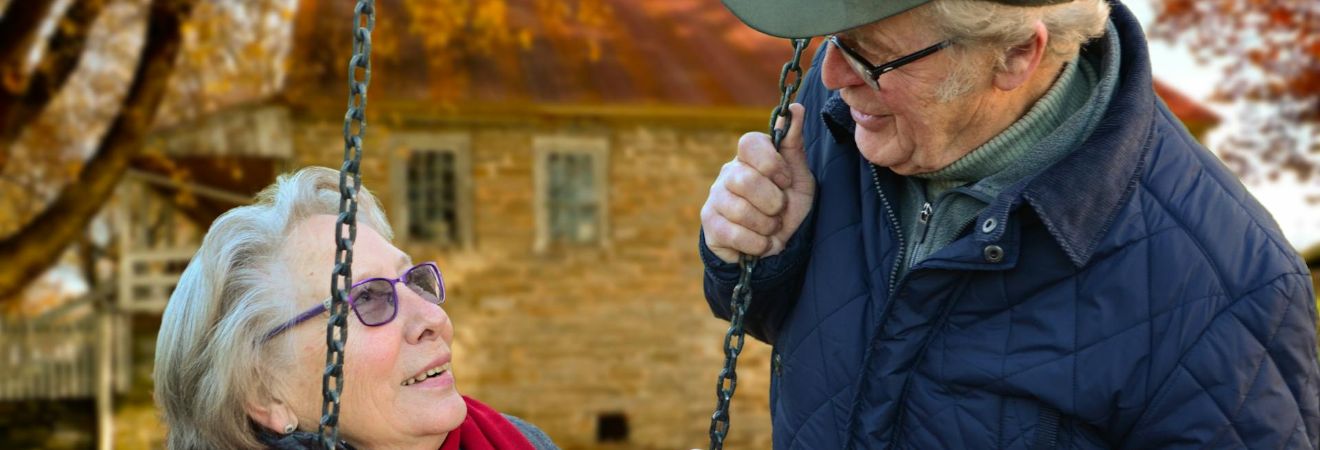Elderly couple enjoying a peaceful moment outdoors, representing life transitions often supported by senior movers.