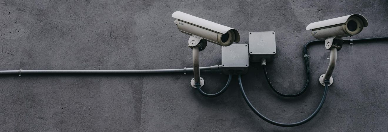 Security cameras overlooking a storage warehouse.