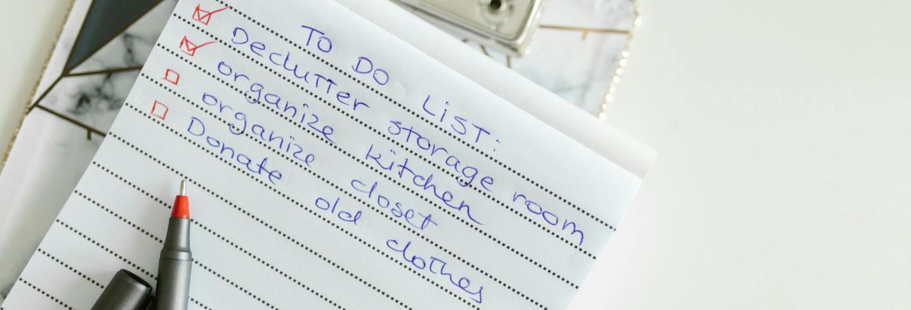 A notebook with a checklist written on it