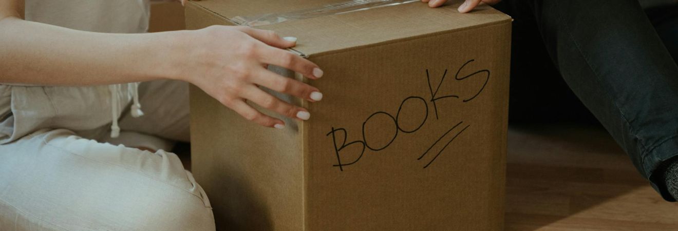 Hands touching a box
